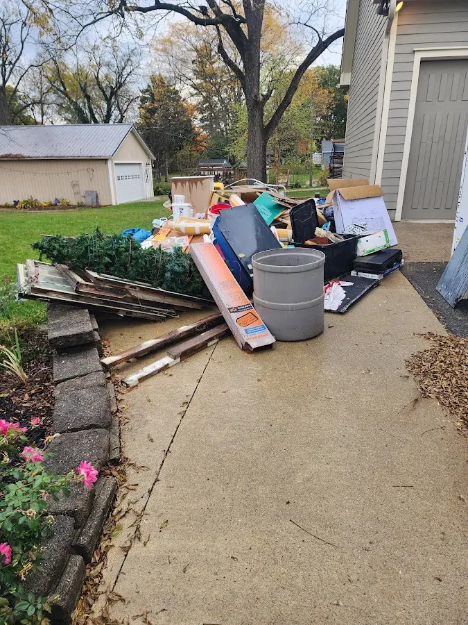 Dumpster being loaded with debris for Residential Dumpster Rental in Arcadia